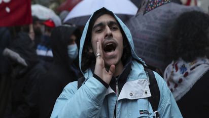 An anti-government protester chants slogans during a demonstration to denounce the country's deteriorating economic and financial conditions, in front of the Central Bank in Beirut, Lebanon, Sunday, Jan. 23, 2022. (AP Photo/Bilal Hussein)