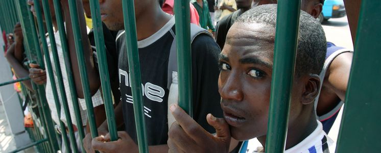 Children at a gate in Angola's capital Luanda.