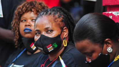 DURBAN, SOUTH AFRICA - APRIL 26: Marchers at the China Mall, formally the Wheel Shopping Centre during the Gender-Based Violence (GBV) protest march organised by the Office of The Premier in collaboration with Phepha Foundation on April 26, 2021 in April 26, 2021 in Durban, South Africa. According to a media release,  the march was triggered by high-profile cases which were reported to the KZN Provincial Gender-Based Committee where three women, who were employed as cleaners in the China Mall shopping Centre, were allegedly sexually assaulted at work by their manager and supervisor. (Photo by Darren Stewart/Gallo Images via Getty Images)