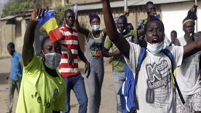 People protest in N'Djamena, Chad, Tuesday, April 27, 2021. Thousands of people protested and two people were killed in Chad Tuesday in demonstrations against the rule of a transitional military council headed by the son of the late President Idriss Deby Itno, who was killed last week. (AP Photo/Sunday Alamba)