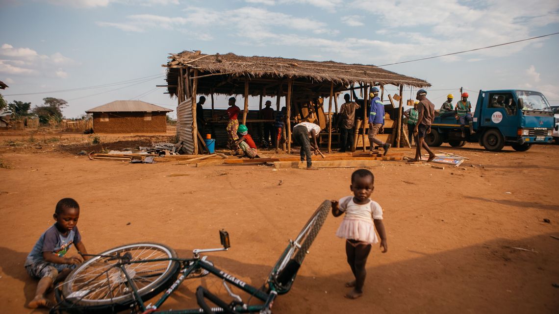 Two of Issa Said's kids playing in between their home and the carpentry workshop in Corrane on October 8, 2025