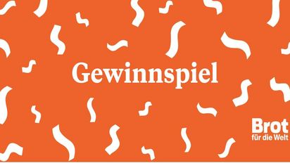 Karte mit Konfetti und der Aufschrift Gewinnspiel, Orange und Weiß