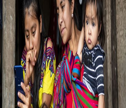 Margarita Baca (19) with her smartphone in Zona Reina, Guatemala.