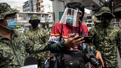 Police officers arrest members and allies of LGBTQIA+ organization Bahaghari during the Pride March Protest in Manila, Philippines on June 26, 2020. At least 20 individuals were brought to the Manila Police District (MPD) Headquarters.(Photo by Lisa Marie David/NurPhoto/picture alliance