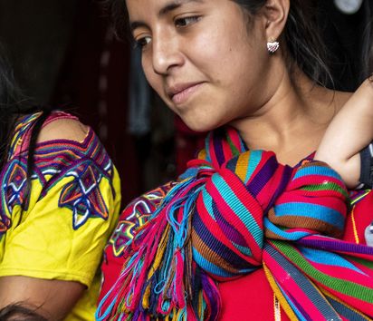 Margarita Baca (19) with her smartphone in Zona Reina, Guatemala.