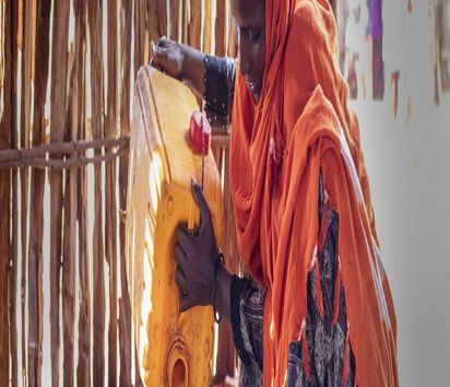 Fatuma Abdullhai (35) boils water for tea at her home in Tarama in north-eastern Kenya.