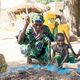 Schlagen von Getreide in Burkina Faso